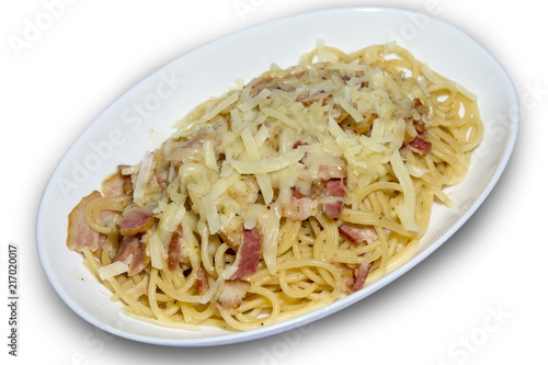 Cheesy spaghetti with bacon on white isolated background