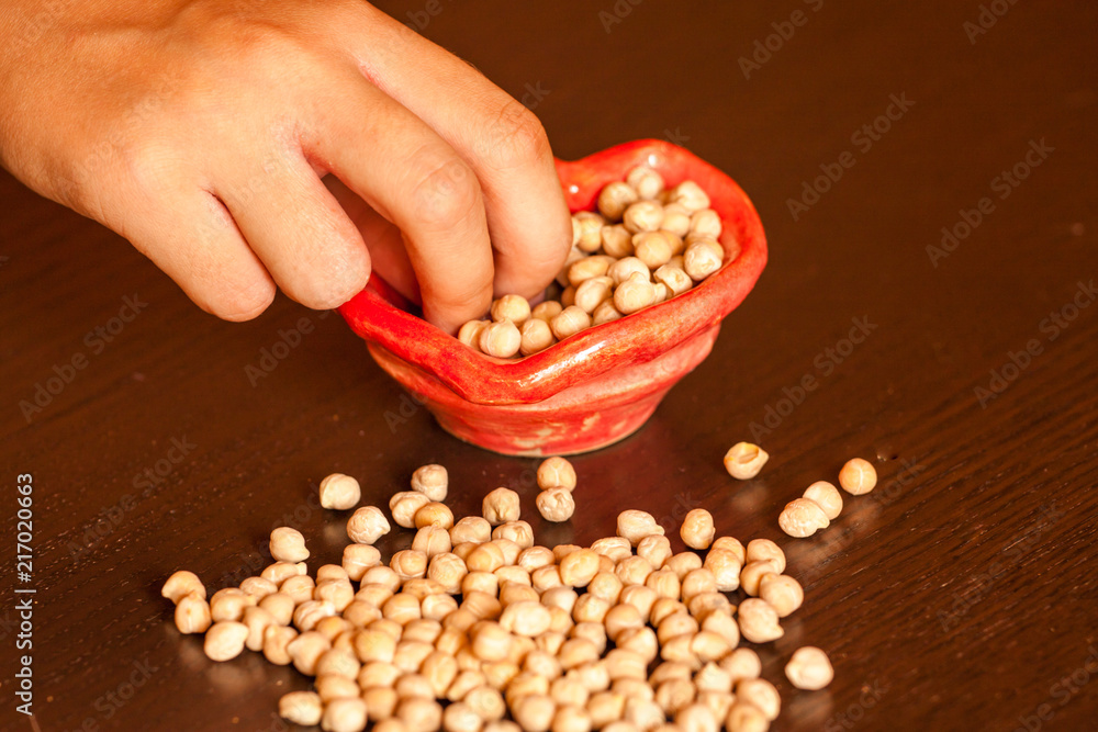Сhickpeas in a red bowl Сhickpeas in a red bowl
