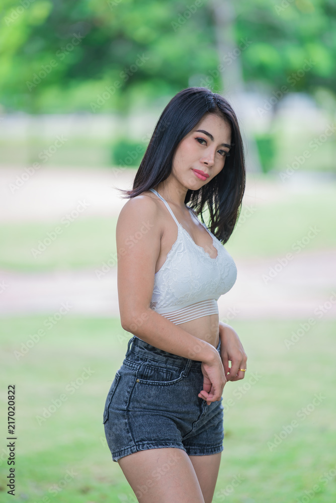 Portrait of beautiful asian woman black hair outdoor,Happy woman concept,Lifestyle of modern girl,Thailand people on the road in the forest Portrait of beautiful asian woman black hair outdoor,Happy woman concept,Lifestyle of modern girl,Thailand people on the road in the forest