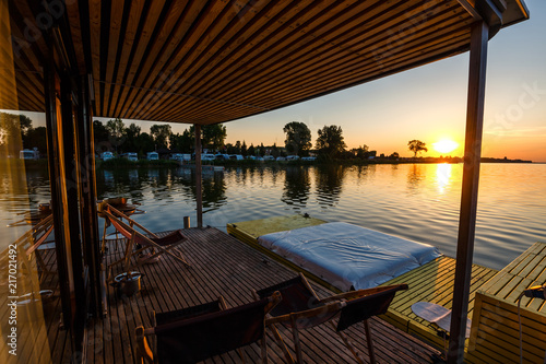 floating cottage on the lake at sunrise