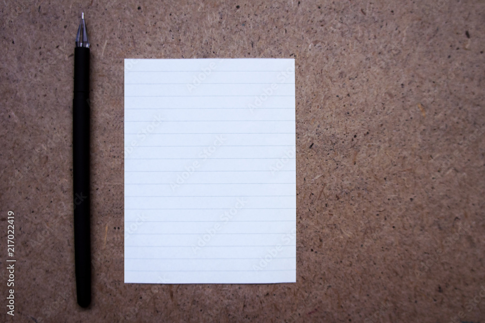A sheet of paper and black pen. Back to school, Paper for notes, Office stationery. Blank sheet of paper and pen A sheet of paper and black pen. Back to school, Paper for notes, Office stationery. Blank sheet of paper and pen