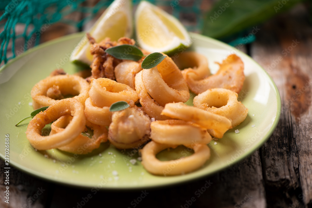 Golden fried calamari squid on a plate Golden fried calamari squid on a plate
