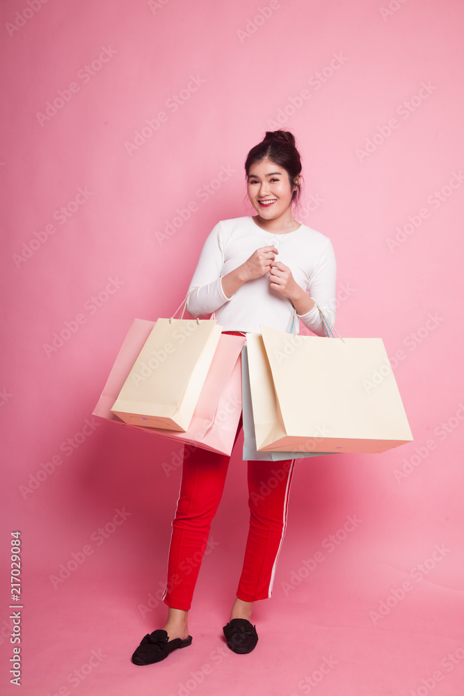 Young Asian woman happy with shopping bag Young Asian woman happy with shopping bag