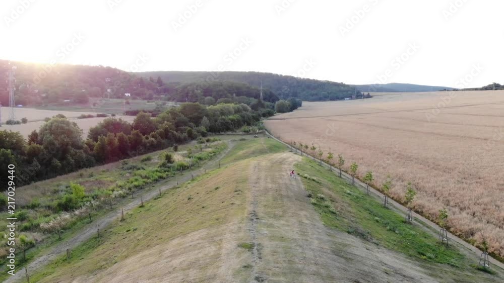 Flight over a small hill by sunset. Flight over a small hill by sunset.