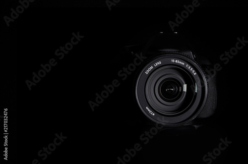 SLR camera lens on a black background