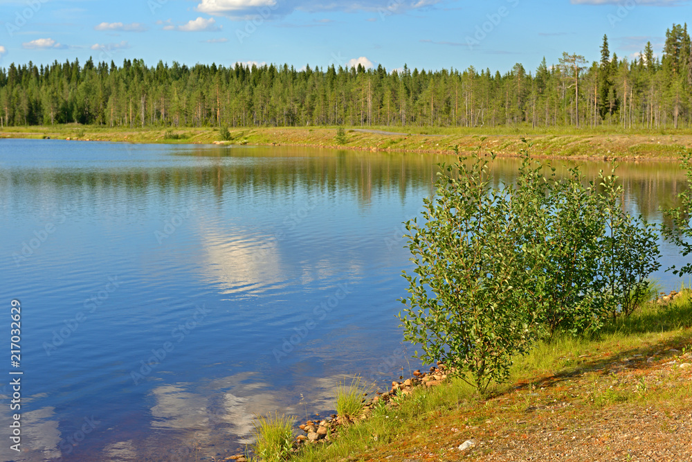 White cloud in water. Northern landscape. Finnish Lapland
