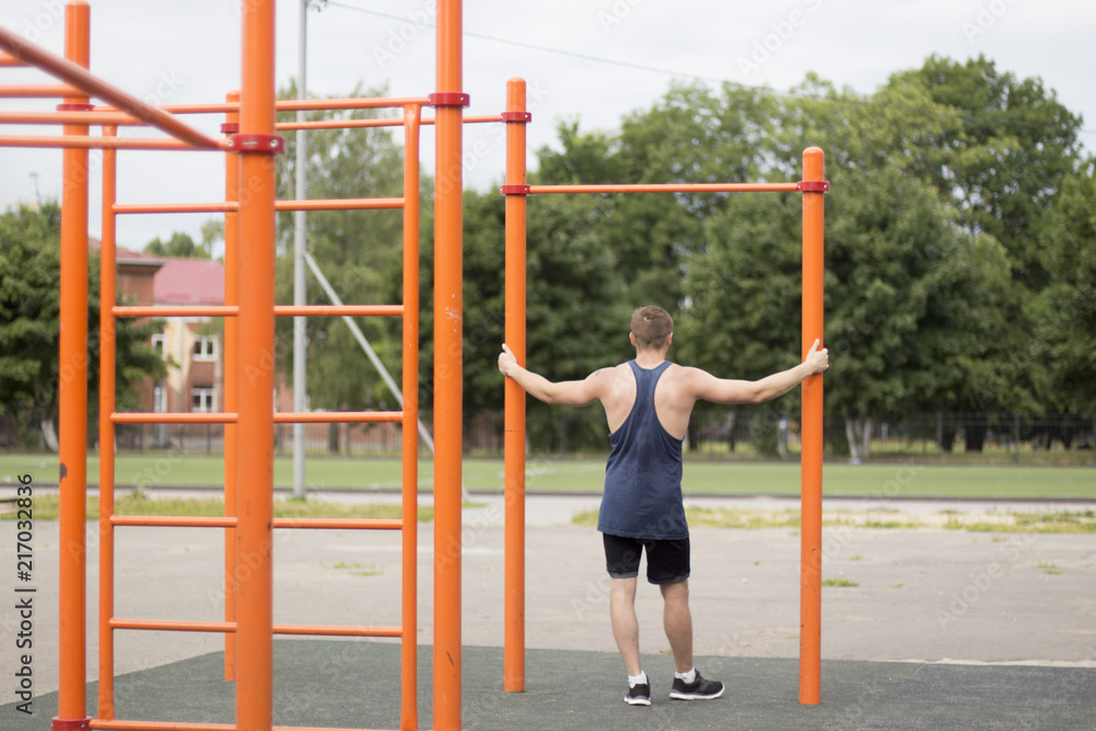 a man in a black t-shirt engaged in the Playground