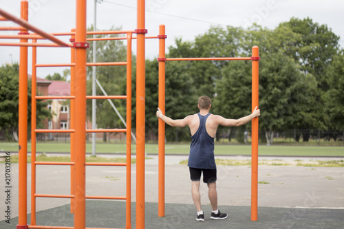 a man in a black t-shirt engaged in the Playground
