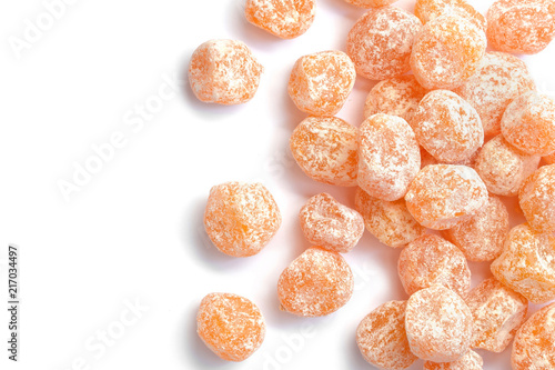 Dried sweet kumquat under powdered sugar isolated on white background.