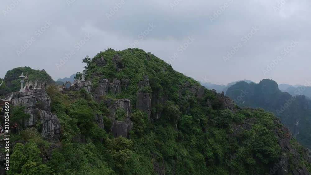 Flying along the ridge line of the dragon temple in Ninh Binh. Tam Coc, Vietnam 2017. Flying along the ridge line of the dragon temple in Ninh Binh. Tam Coc, Vietnam 2017.