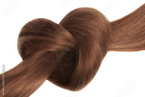 Fototapeta Brown hair knot in shape of heart, isolated on white background