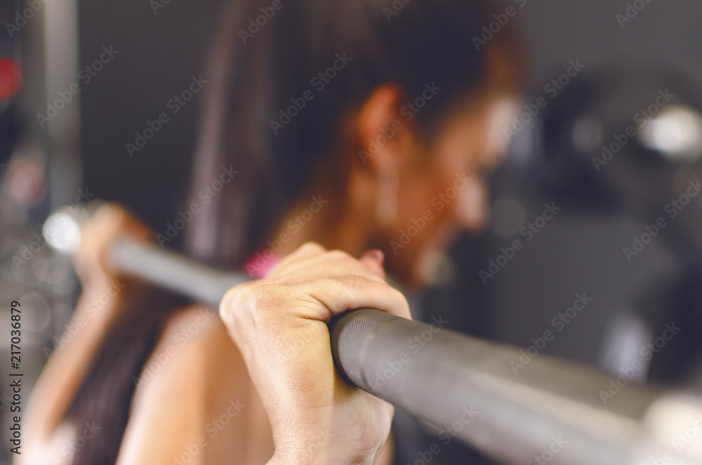 Obraz premium Woman doing squats