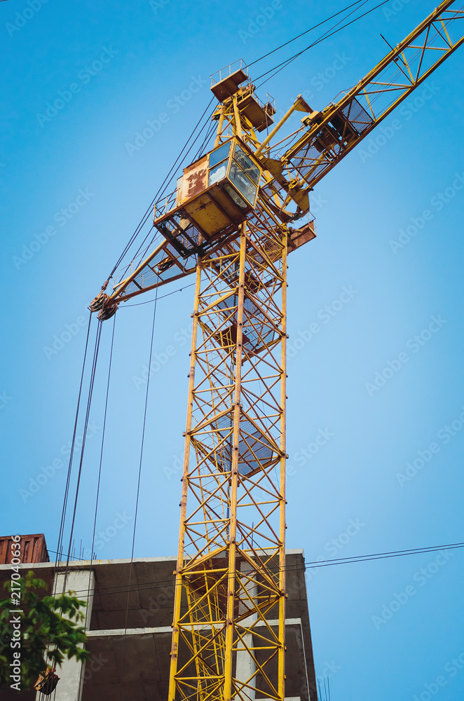 Crane on a blue sky background.