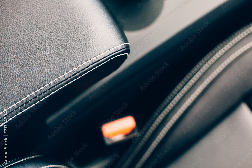 Detail of a car armrest in a leather upholstery