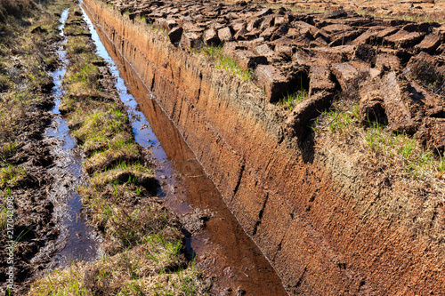 Cutted peat for whisky distilleries on island Islay, Scotland photo
