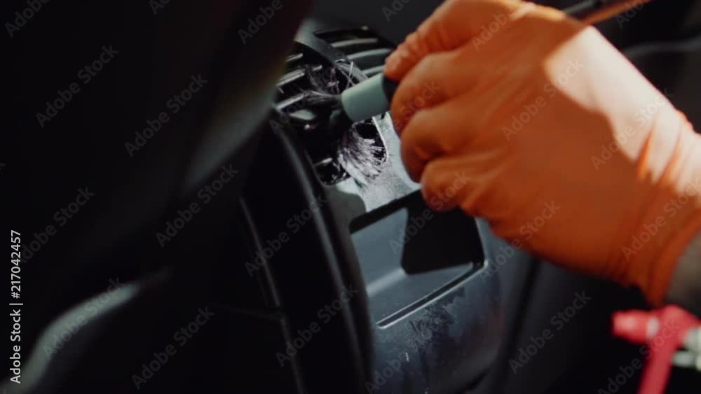 man does dry cleaning of the car man does dry cleaning of the car