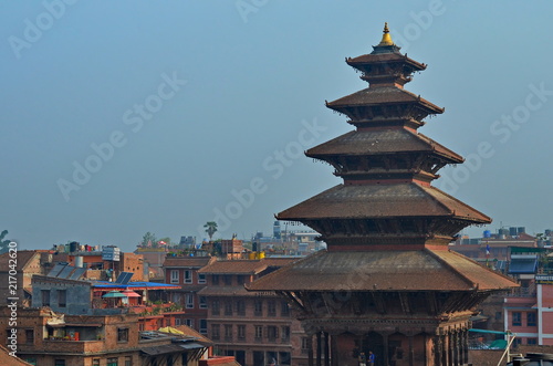 High pagoda in the background of roofs