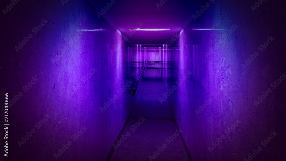 Tunnel, a long corridor at the end of which is light. Basement with illuminated walls. Neon Tunnel, a long corridor at the end of which is light. Basement with illuminated walls. Neon