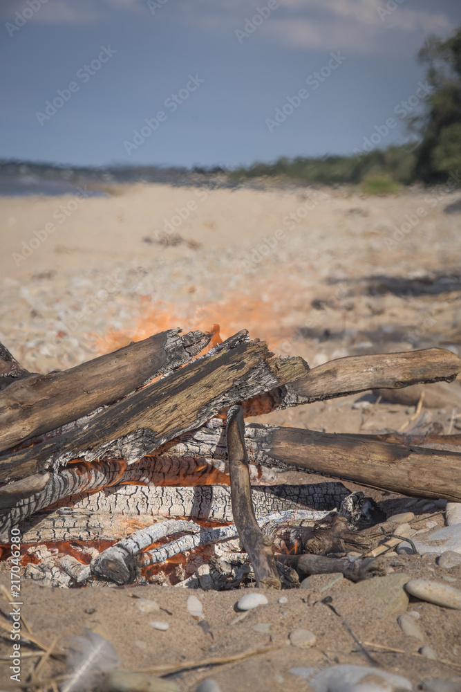 A bonfire burns in a camping i A bonfire burns in a camping i