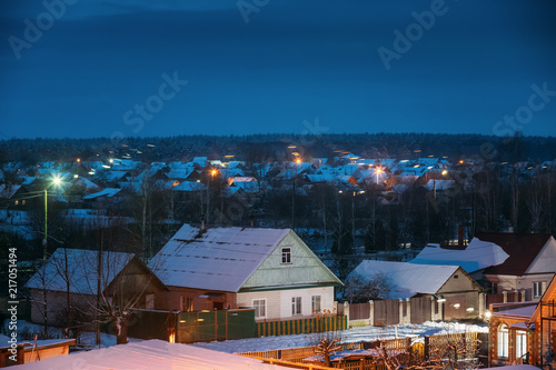 Belarusian Village In Eastern Europe In Winter Twilight Time.