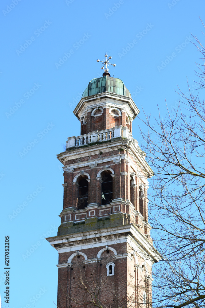 A nice view the little town of Rovigo, in the Po valley in Veneto. Here the high bell tower of the octagonal church A nice view the little town of Rovigo, in the Po valley in Veneto. Here the high bell tower of the octagonal church