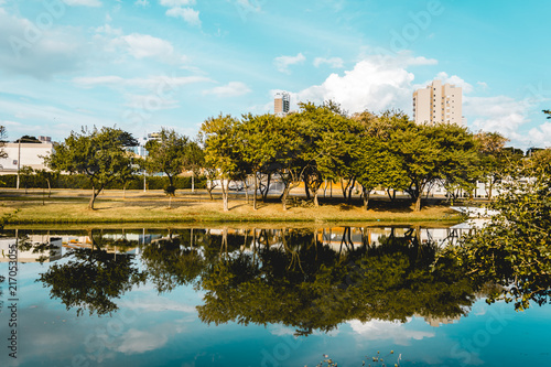 The trees of a park reflected on the water of a river, in the Ecological Park, in Indaiatuba, Brazil.