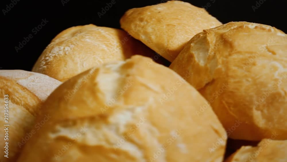Many crunchy bread pieces on a rotating spinning surface, mix of medium and close-up front shots.
Many crunchy bread pieces on a rotating spinning surface, mix of medium and close-up front shots.
