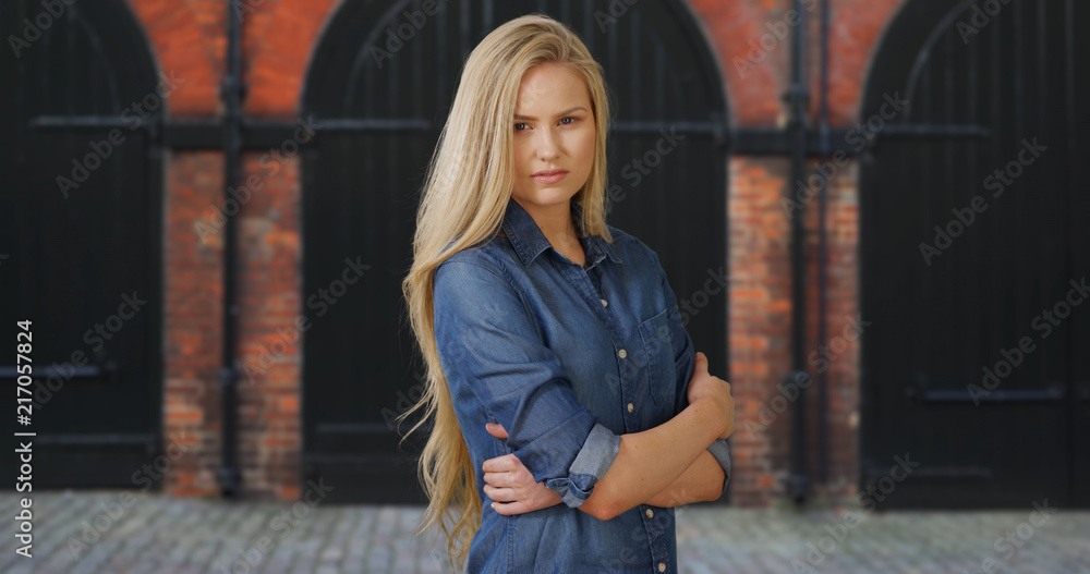 Naklejka premium Young attractive Caucasian girl looks at camera with confidence