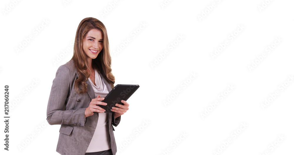 Portrait of good-looking white female using tablet device on white background Portrait of good-looking white female using tablet device on white background