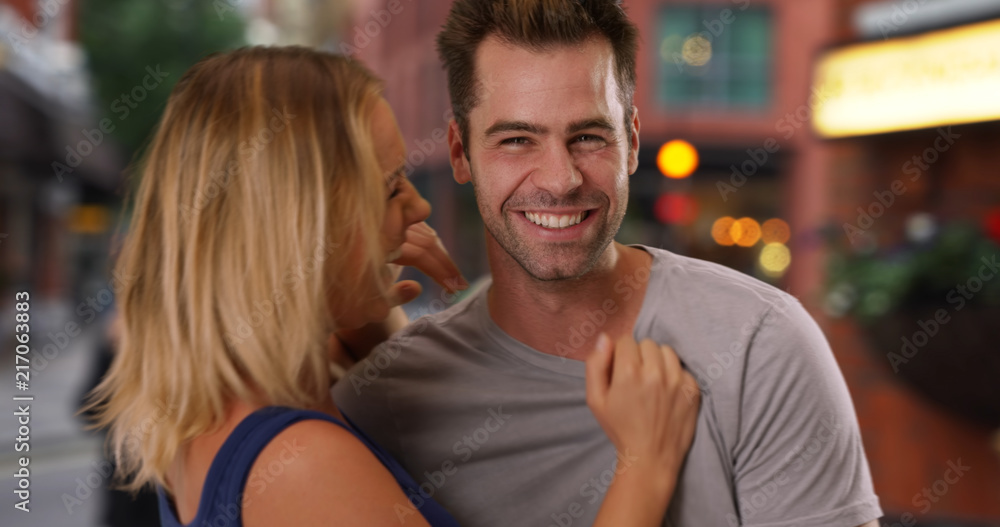 Casual portrait of cheerful young couple on London street Casual portrait of cheerful young couple on London street