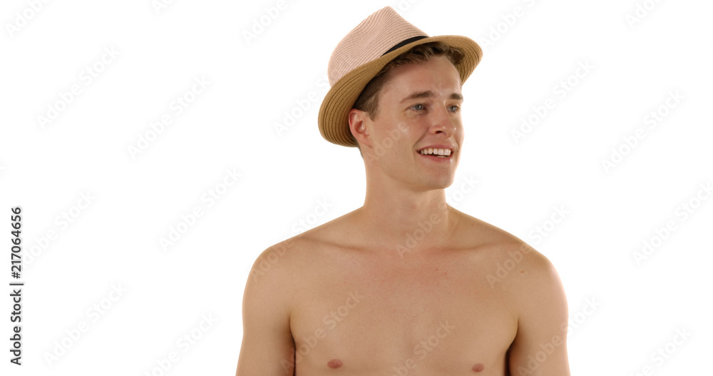 Cool and handsome young man modeling stylish hat in studio with copyspace