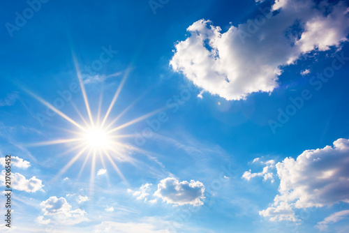 Sunny background  blue sky with white clouds and sun