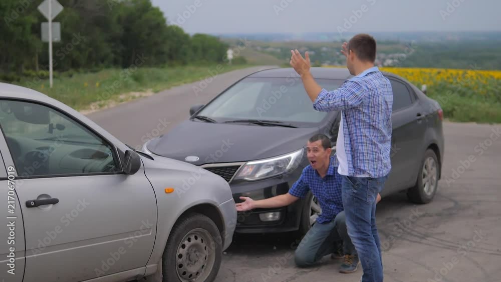Two men arguing conflict after a car accident on the road lifestyle car insurance. slow motion video. Two Drivers man Arguing After Traffic Accident. auto insurance accident concept men Two men arguing conflict after a car accident on the road lifestyle car insurance. slow motion video. Two Drivers man Arguing After Traffic Accident. auto insurance accident concept men