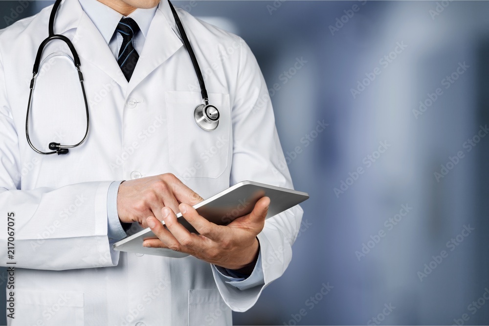 Doctor at hospital working with tablet Doctor at hospital working with tablet