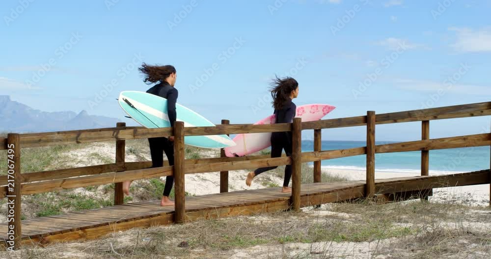 Couple running with surf board 4k Couple running with surf board 4k