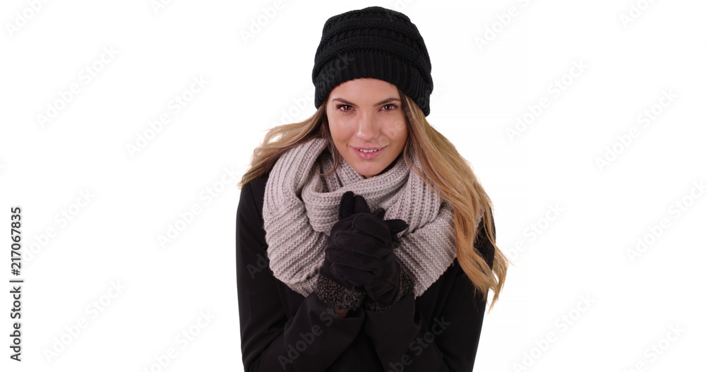 Pretty Caucasian woman in cozy winter clothes on white background with copyspace Pretty Caucasian woman in cozy winter clothes on white background with copyspace