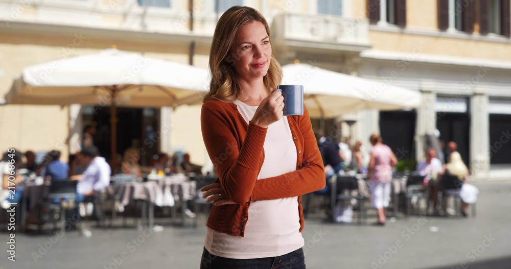 Portrait of Caucasian woman enjoying coffee outside