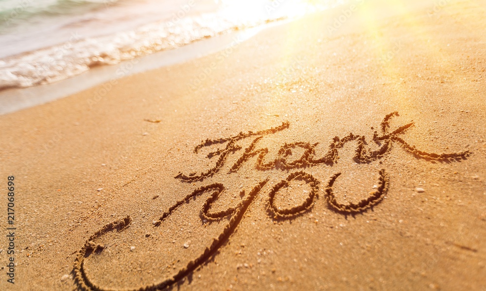 Fototapeta premium Thank you sign on sandy sea beach