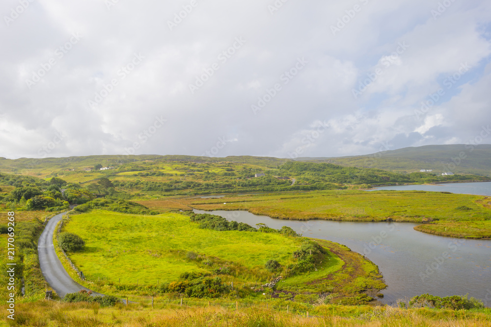 Fototapeta premium Panorama of mountains, marshy land and heathland of Connemara National Park in summer