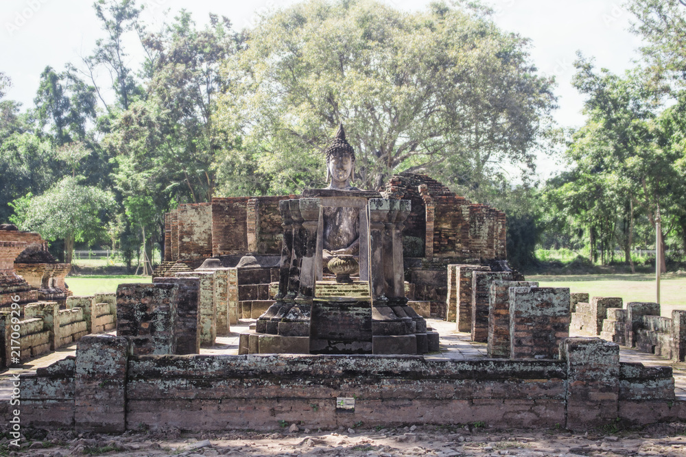 Wat Si Chum temple ruins with sitting buddha statue. Sukhothai Historical Park, Thailand