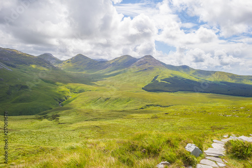 Panorama of mountains  marshy land and heathland of Connemara National Park in summer