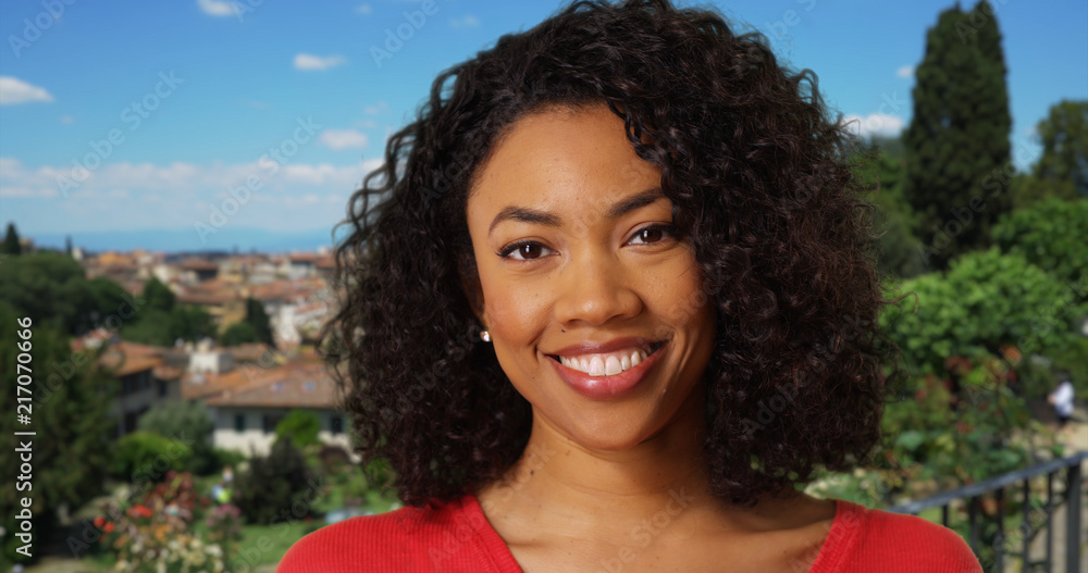 Pretty young black female laughing at camera cheerfully in Florence Italy Pretty young black female laughing at camera cheerfully in Florence Italy