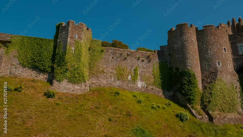 Beautiful tracking shot of the medieval Dover Castle in Kent, a 11th century stronghold and also the largest castle in England. The castle is home to a Roman lighthouse and St Mary in Castro church. Beautiful tracking shot of the medieval Dover Castle in Kent, a 11th century stronghold and also the largest castle in England. The castle is home to a Roman lighthouse and St Mary in Castro church.
