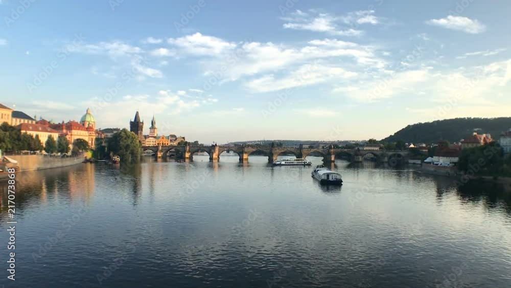 Stunning opening shot showing Vltava river and Charles bridge in golden hour Stunning opening shot showing Vltava river and Charles bridge in golden hour