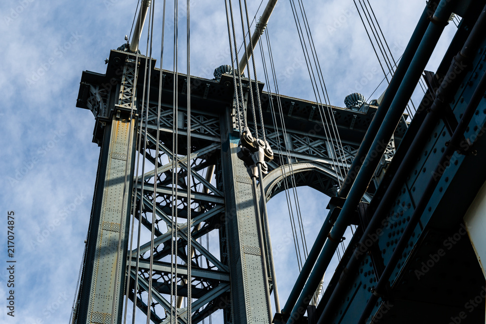 Fototapeta premium Brooklyn, NY / USA - JUL 31 2018: Looking up at details of Manhattan Bridge