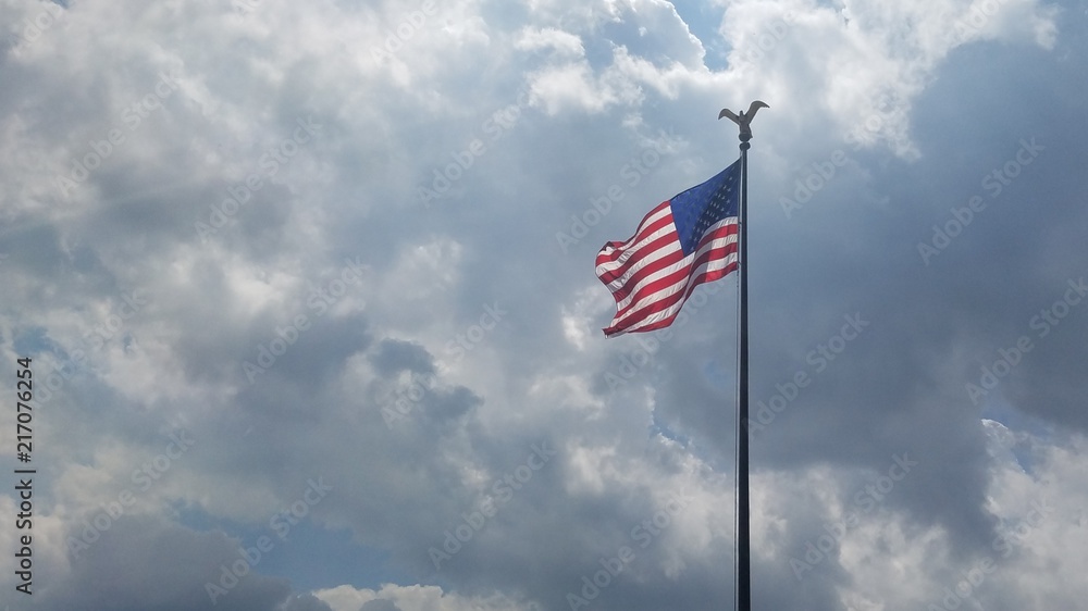 Flag flowing in breeze clouds Flag flowing in breeze clouds