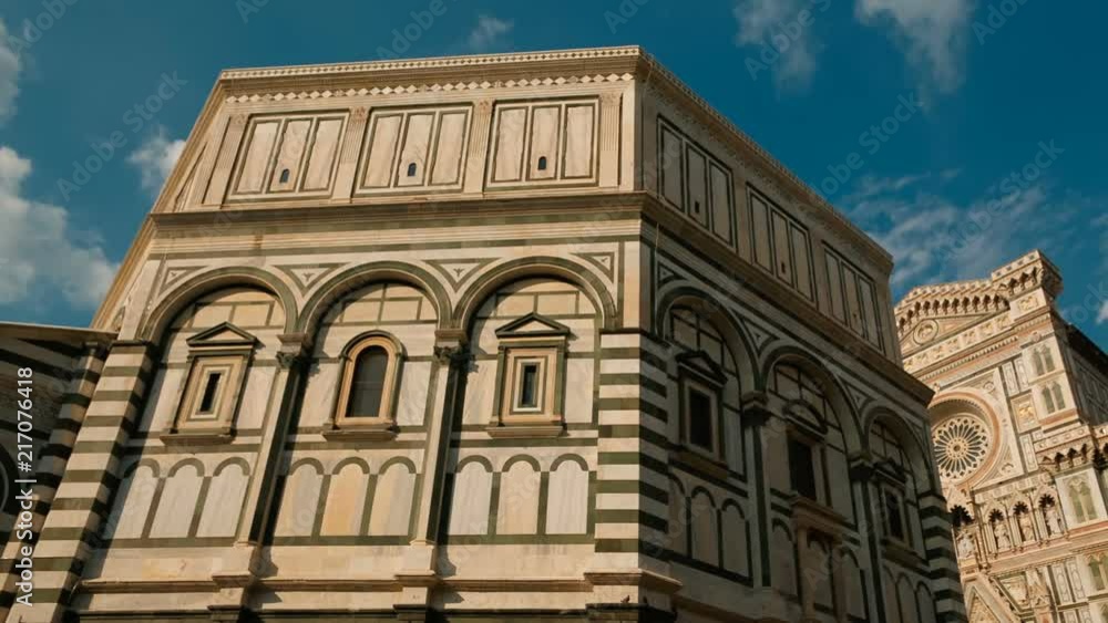 Panning shot of the famous Florence Cathedral, Cattedrale di Santa Maria del Fiore or Duomo di Firenze, and Giottos Campanile. Florence is considered the birthplace of the Renaissance Panning shot of the famous Florence Cathedral, Cattedrale di Santa Maria del Fiore or Duomo di Firenze, and Giottos Campanile. Florence is considered the birthplace of the Renaissance
