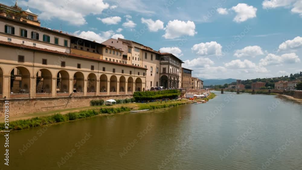 Establishing shot of the Arno River, in Florence, Tuscany, Italy and traditional shops alongside its banks. Capital of Tuscany, Florence is considered the birthplace of the Renaissance Establishing shot of the Arno River, in Florence, Tuscany, Italy and traditional shops alongside its banks. Capital of Tuscany, Florence is considered the birthplace of the Renaissance