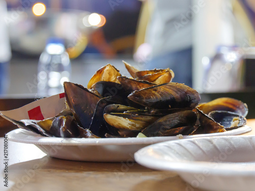 finished Seafood Dish opened and mussels on the table photo