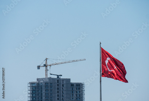Construction crane and building with Turkish flag
